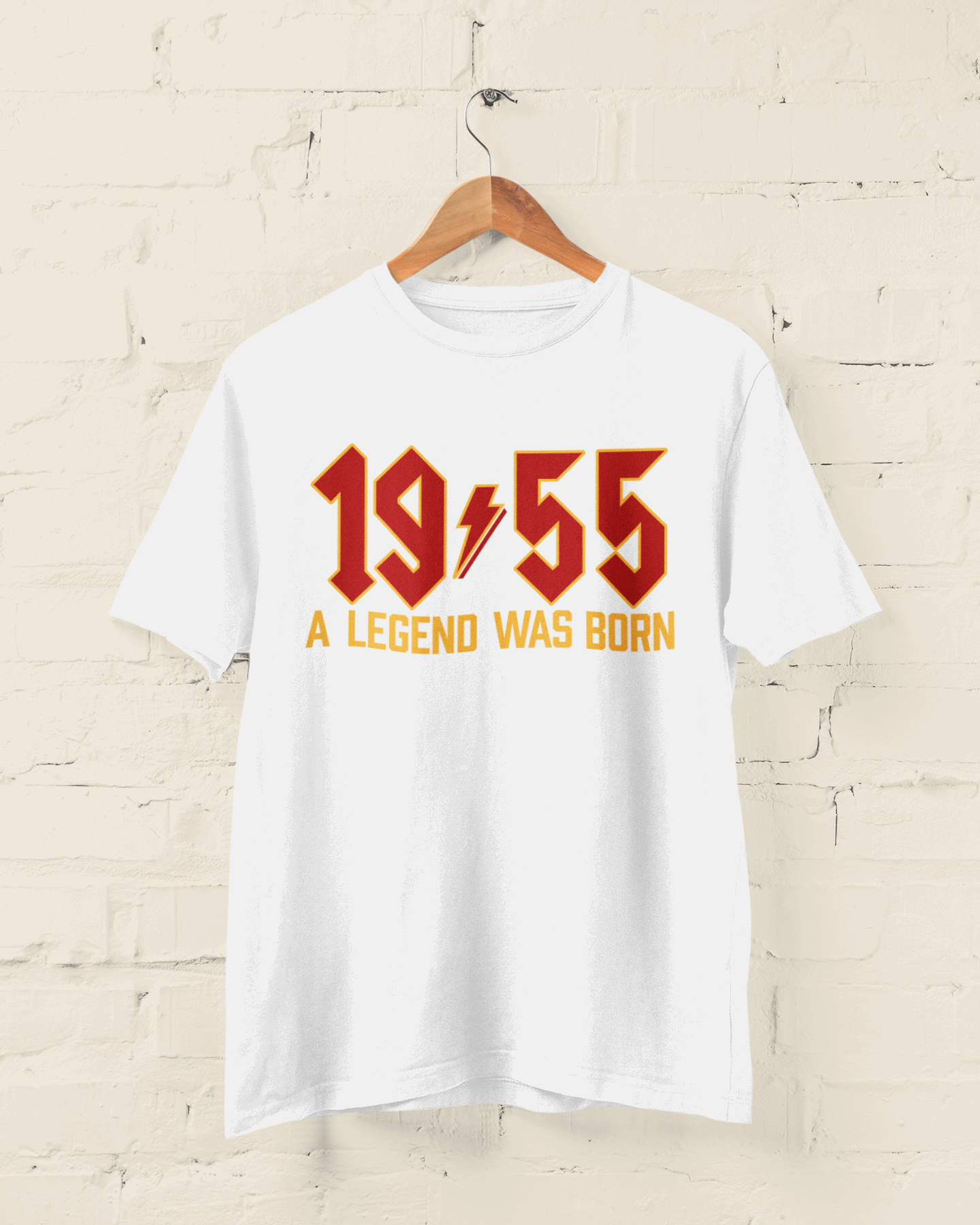 70th birthday T-shirt with "1955 A Legend Was Born" in retro heavy metal font.