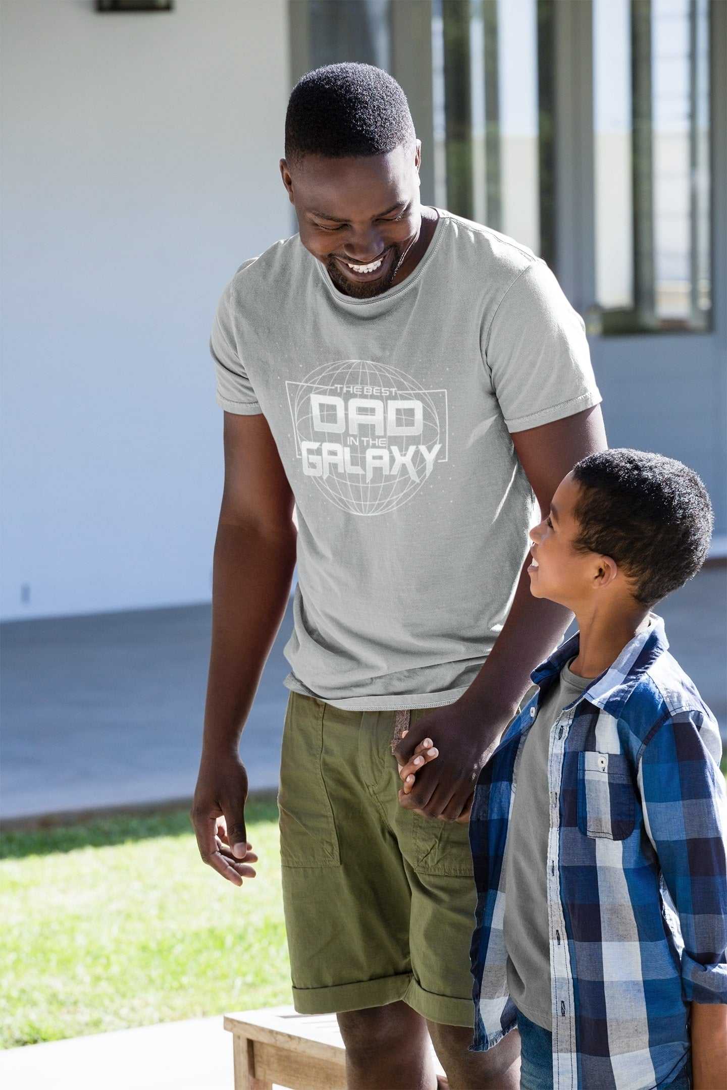 Father wearing "Best Dad in the Galaxy" t-shirt, ideal Father's Day or Christmas gift.