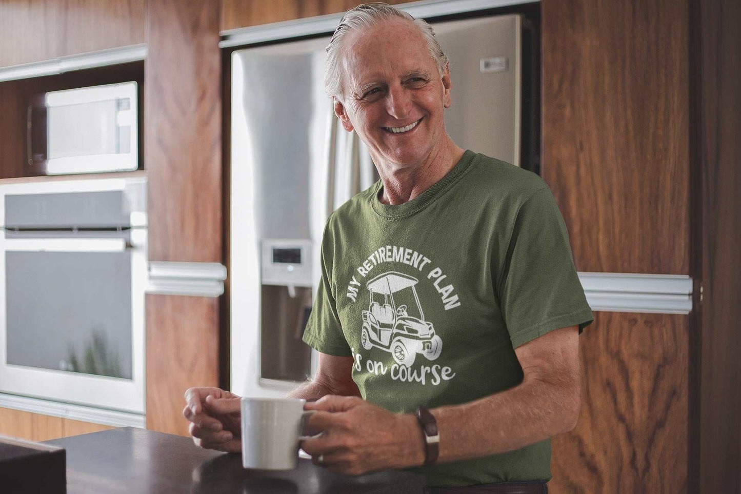 Elderly man wearing a funny golfer retirement t-shirt with "My Plan is On Course" slogan, ideal gift for golf enthusiasts.