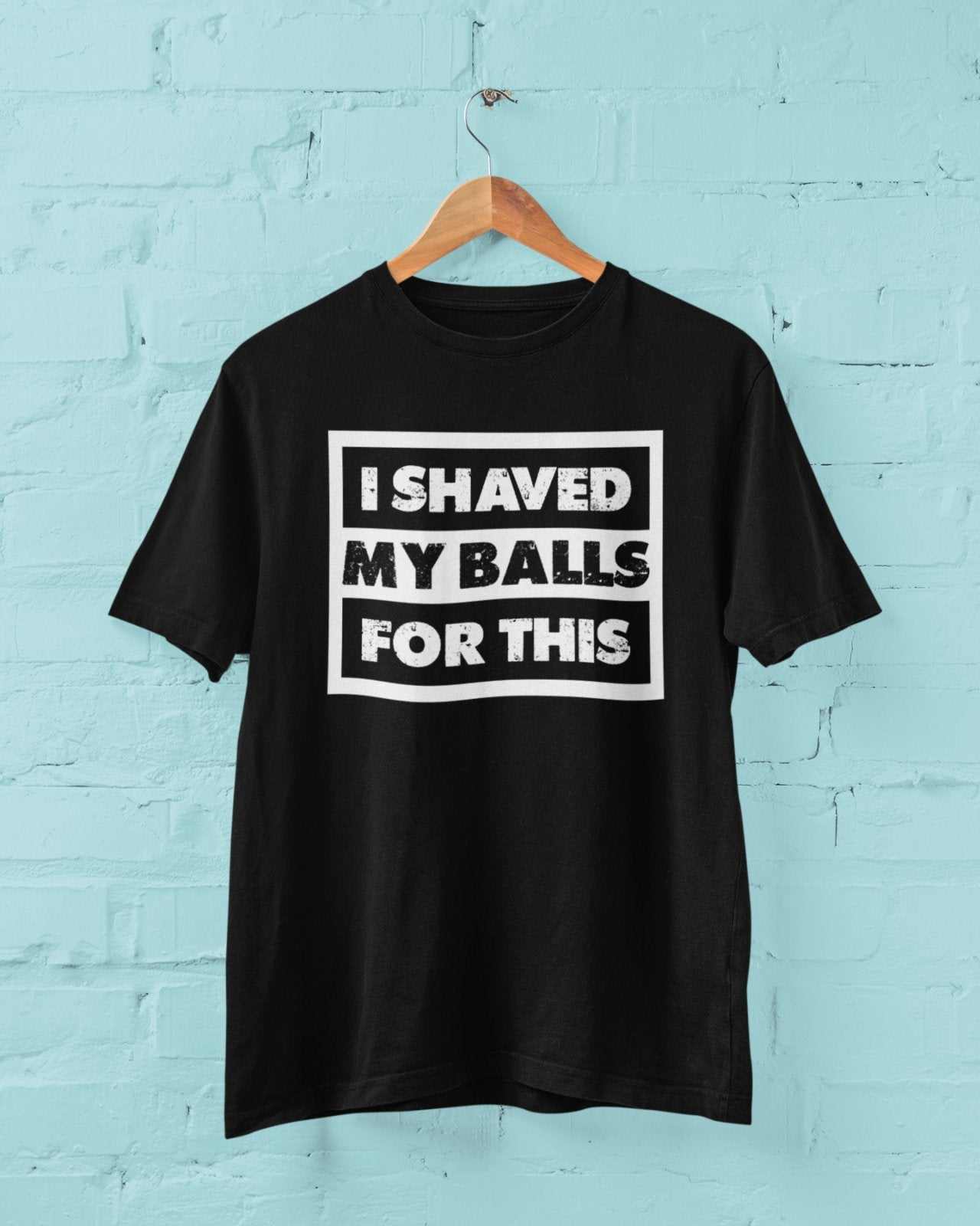Funny sarcastic rude black t-shirt with "I shaved my balls for this" white text design
