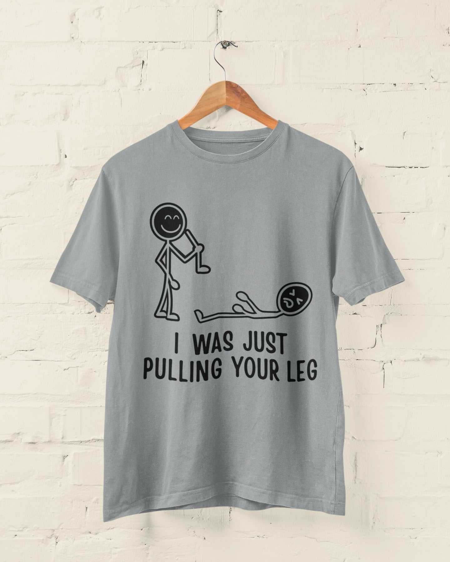 Funny T-shirt with a stick figure pulling leg and text "I Was Just Pulling Your Leg" on a hanger.