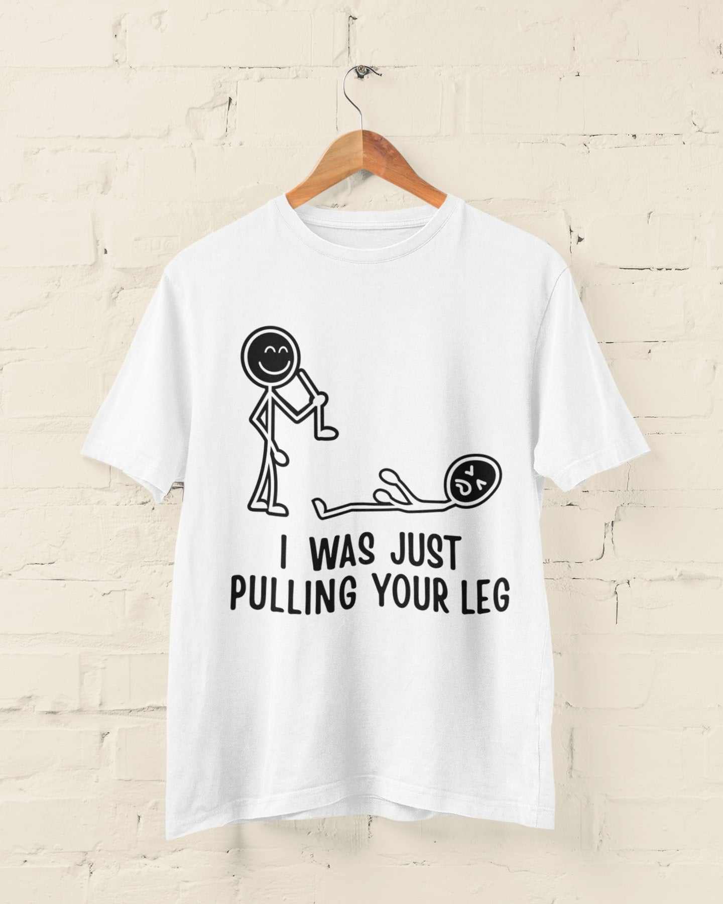 Funny t-shirt with stick figures and "I Was Just Pulling Your Leg" pun, perfect for joke enthusiasts.