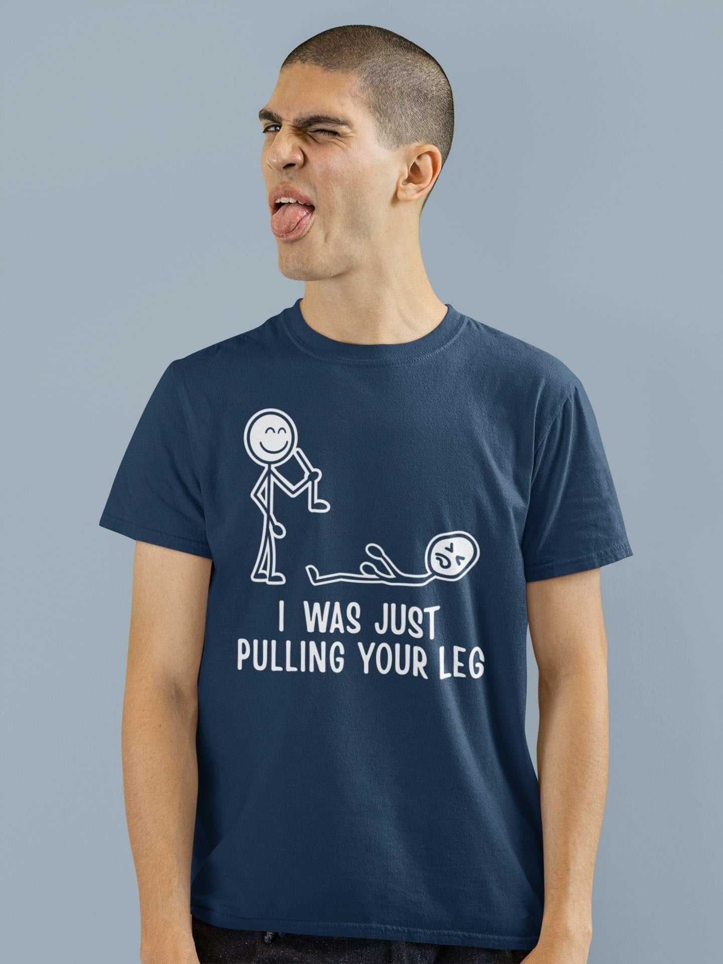 Funny "I Was Just Pulling Your Leg" T-shirt with stick figure joke graphic on a smiling model.