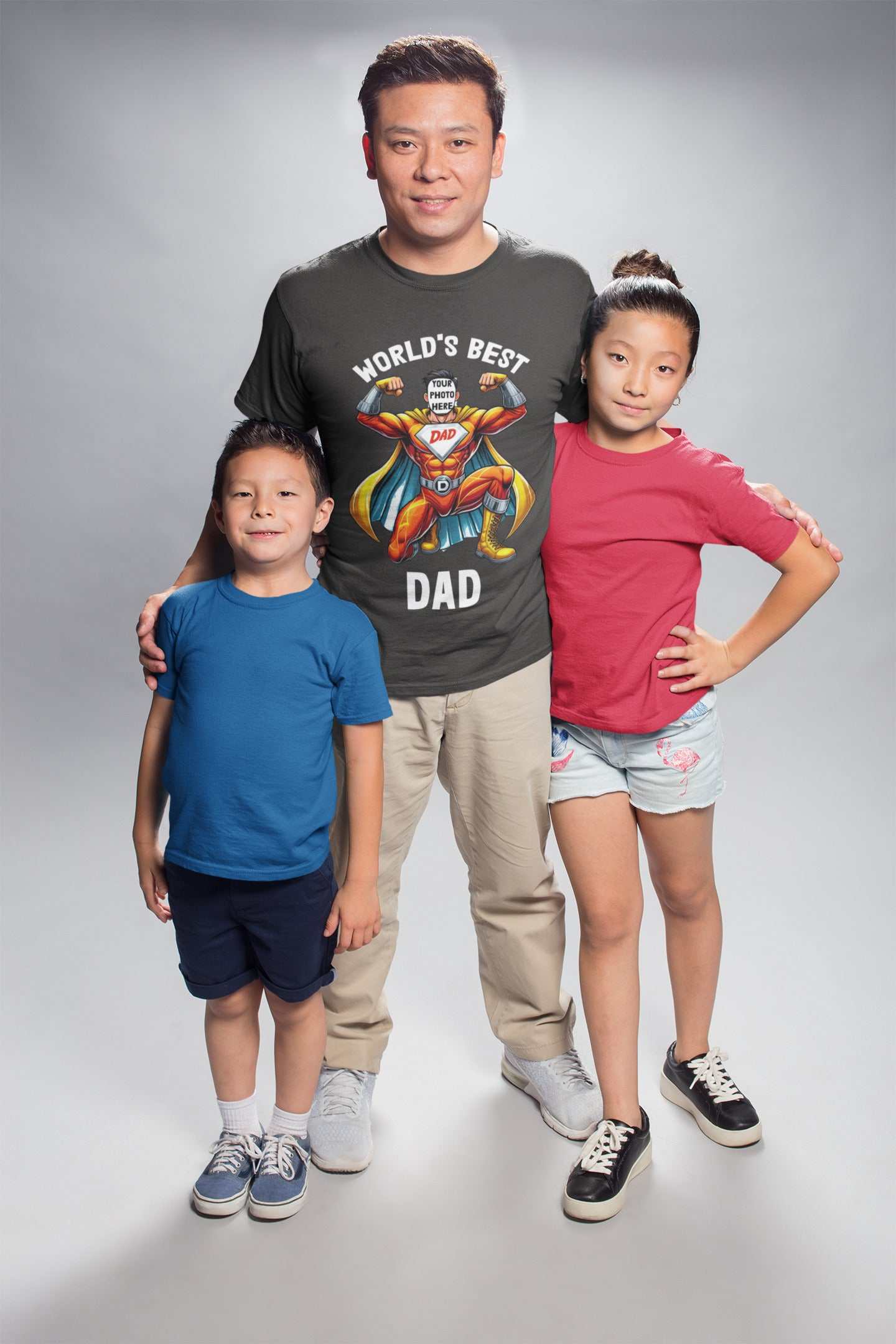 Personalised Superhero Dad T-Shirt worn by dad with two children, featuring custom superhero face design.
