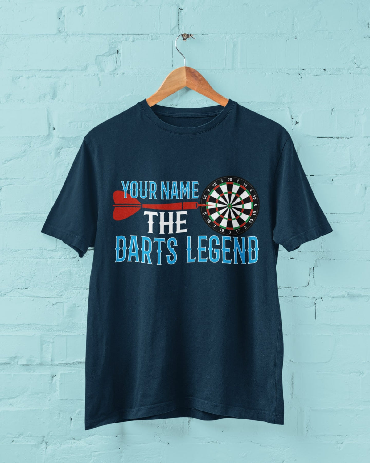 Darts Legend T-shirt with custom name design shown in a wall hanging mockup