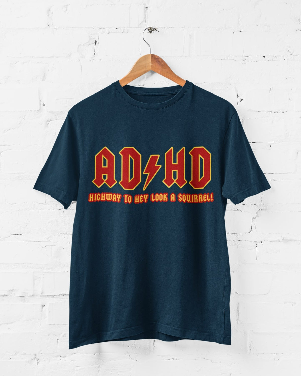 ADHD Highway to Hey Look a Squirrel printed T-shirt in a wall hanging mockup